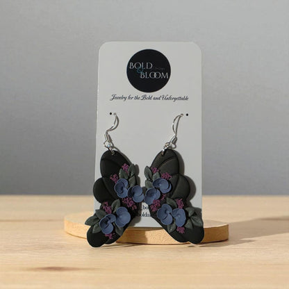Black Butterfly Statement Earrings with purple and blue flowers