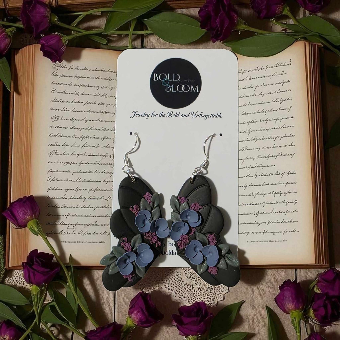 Black Butterfly Statement Earrings with purple and blue flowers
