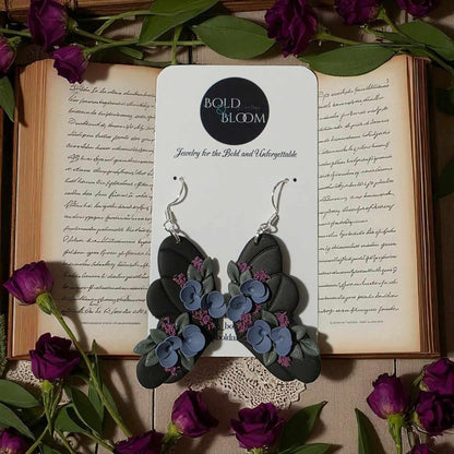 Black Butterfly Statement Earrings with purple and blue flowers