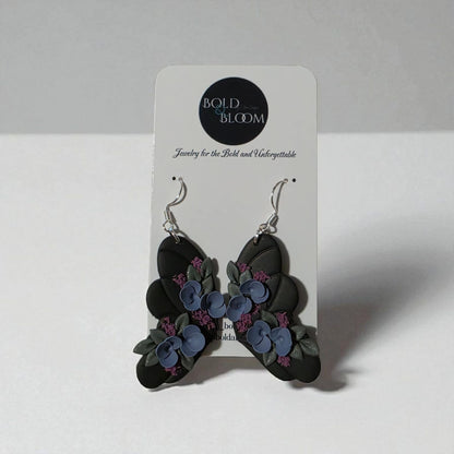 Black Butterfly Statement Earrings with purple and blue flowers