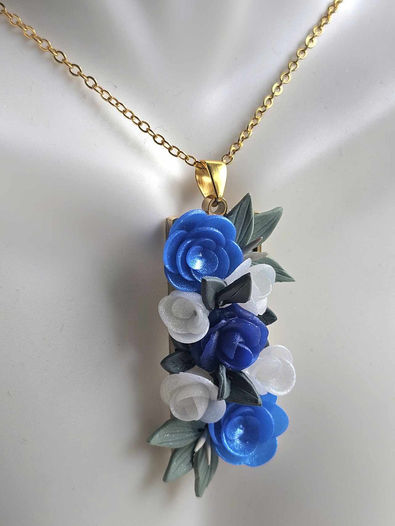 Blooming blue rose pendant necklace