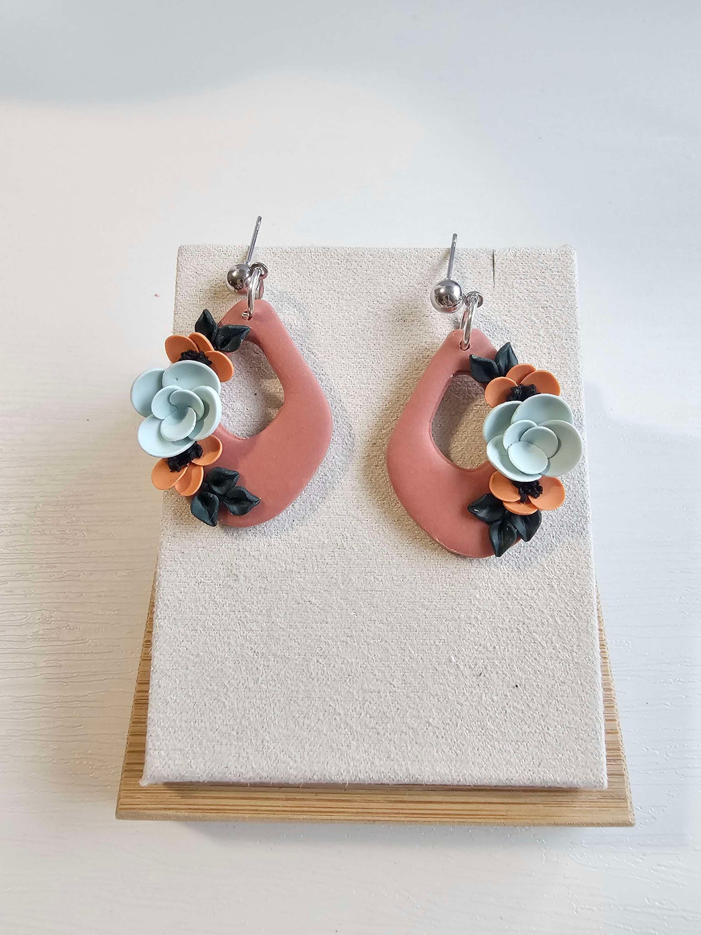Terracotta dangle earrings with floral design image 1