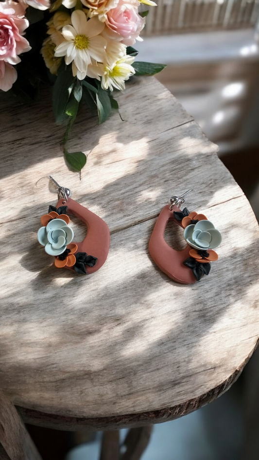 Terracotta dangle earrings with floral design image 0
